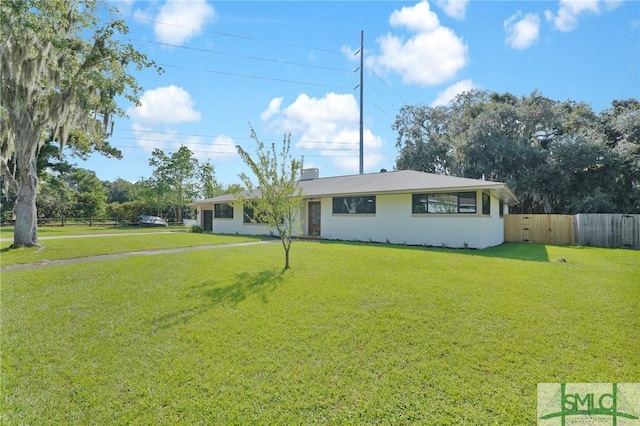 ranch-style house featuring a front lawn