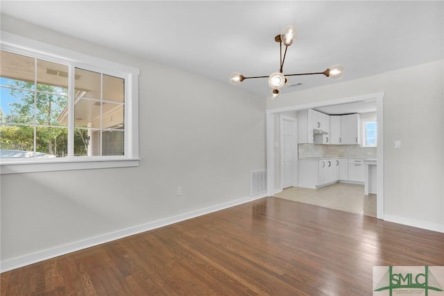 unfurnished living room featuring light hardwood / wood-style flooring