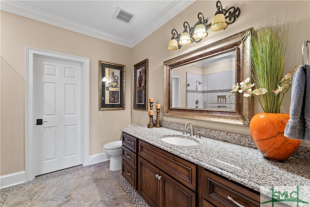 bathroom with tile patterned flooring, crown molding, toilet, and vanity