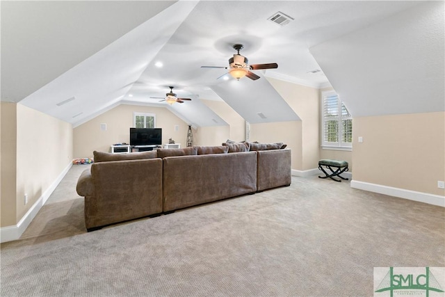 carpeted living room featuring visible vents, baseboards, ceiling fan, and vaulted ceiling