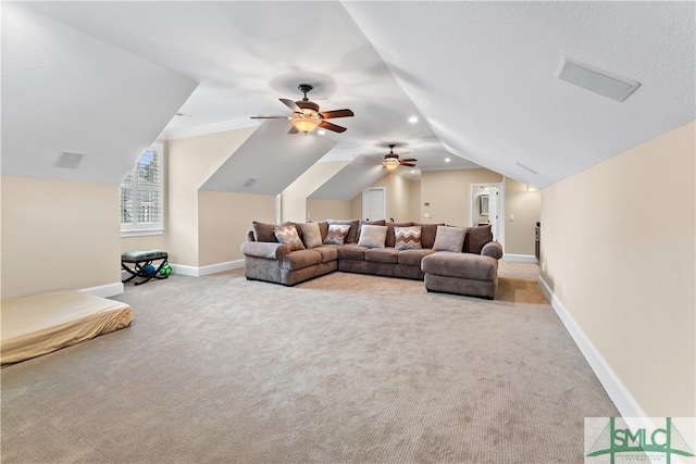 carpeted living room featuring ceiling fan and lofted ceiling