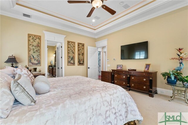 bedroom featuring visible vents, a raised ceiling, ornamental molding, and carpet flooring