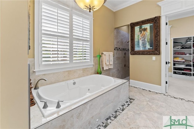 bathroom with a walk in shower, a walk in closet, crown molding, baseboards, and a tub with jets