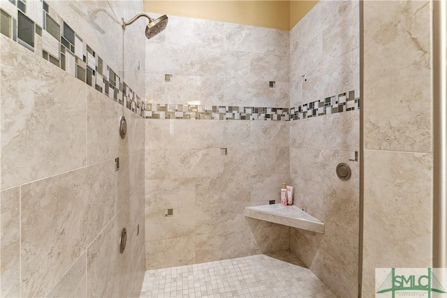 bathroom with a tile shower