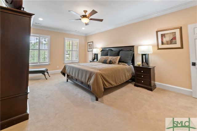 carpeted bedroom featuring ceiling fan and crown molding