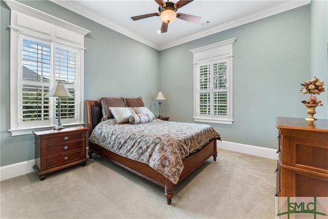 carpeted bedroom with ceiling fan, crown molding, and multiple windows