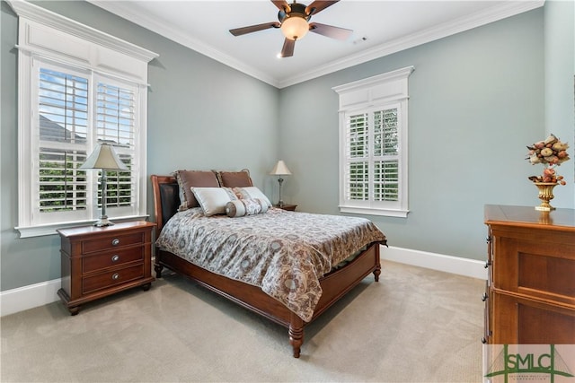 bedroom featuring baseboards, multiple windows, light colored carpet, and crown molding