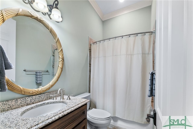 bathroom featuring toilet, vanity, and ornamental molding