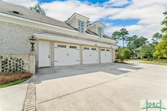 garage with concrete driveway