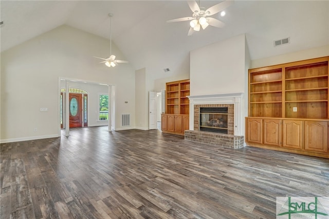 unfurnished living room with ceiling fan, a fireplace, and hardwood / wood-style flooring