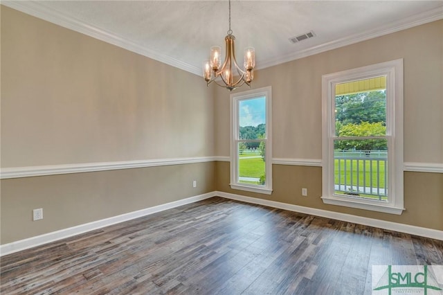 unfurnished room featuring an inviting chandelier, crown molding, a wealth of natural light, and dark hardwood / wood-style flooring