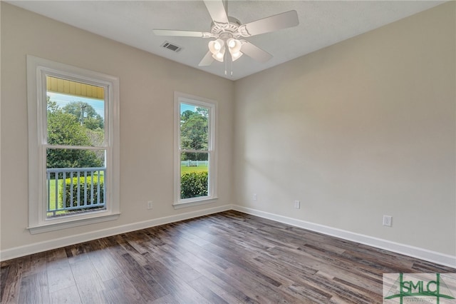 unfurnished room featuring dark hardwood / wood-style floors and ceiling fan