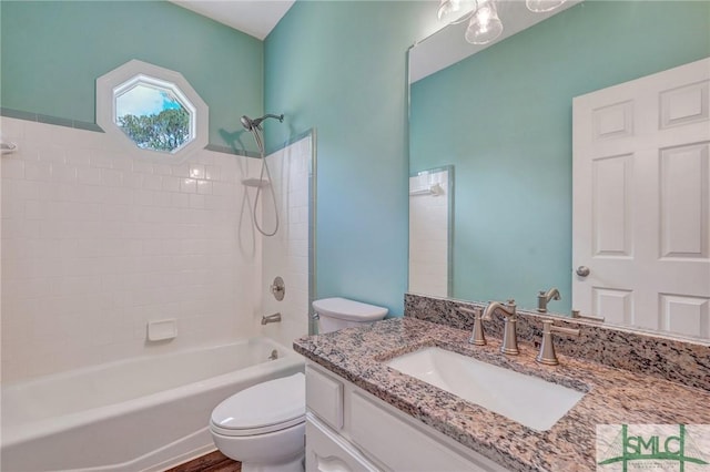 full bathroom featuring vanity, shower / washtub combination, and toilet