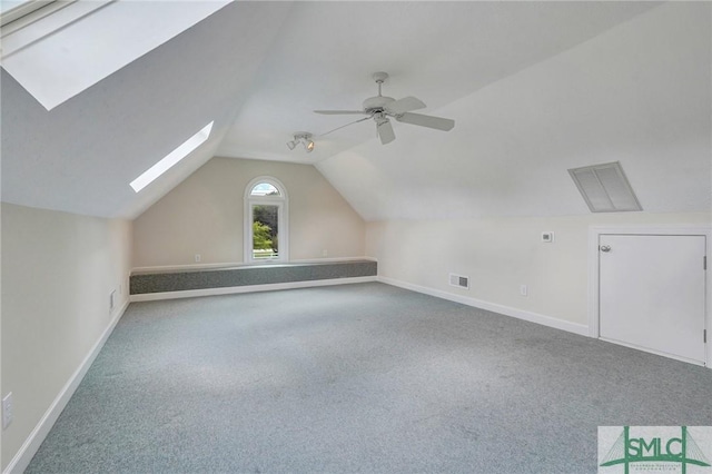 bonus room featuring ceiling fan, vaulted ceiling, and carpet