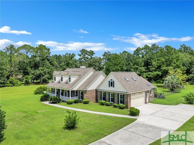 cape cod house with a garage and a front lawn