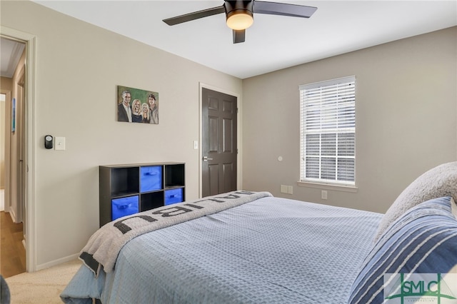 carpeted bedroom with ceiling fan