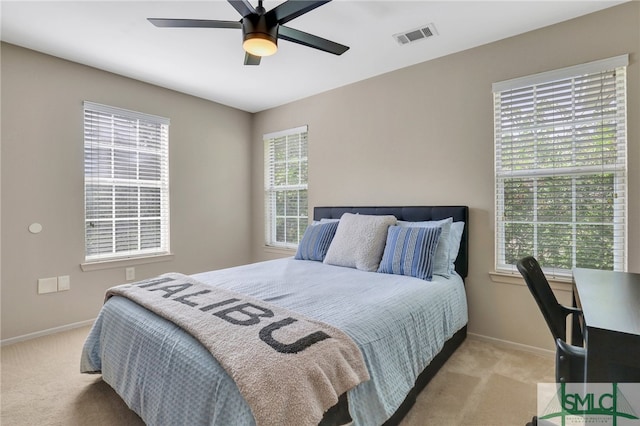 carpeted bedroom featuring ceiling fan