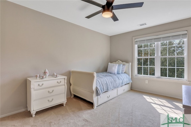 bedroom with ceiling fan and light colored carpet