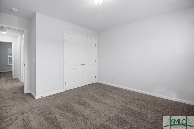 spare room featuring carpet floors