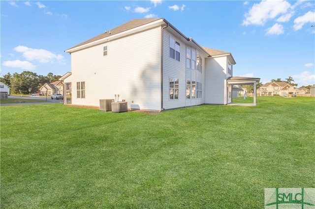 back of house with a lawn