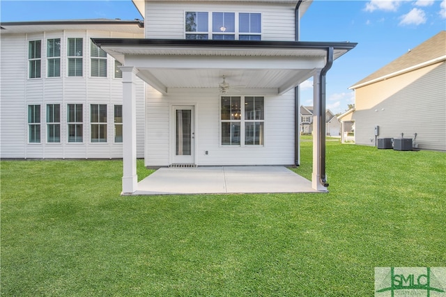 rear view of house featuring a lawn, a patio, ceiling fan, and central AC