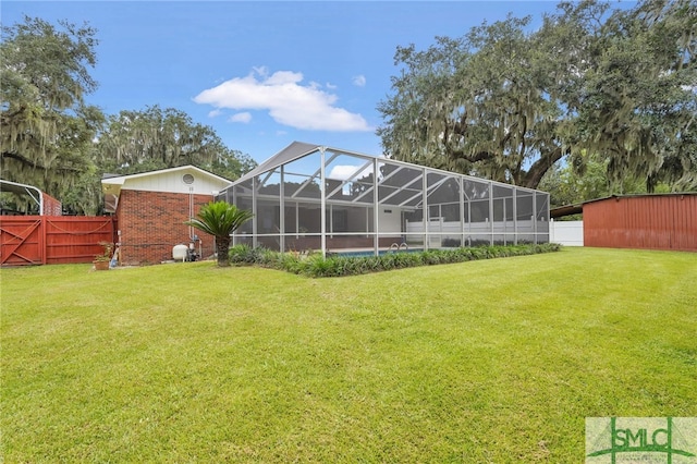 view of yard with glass enclosure