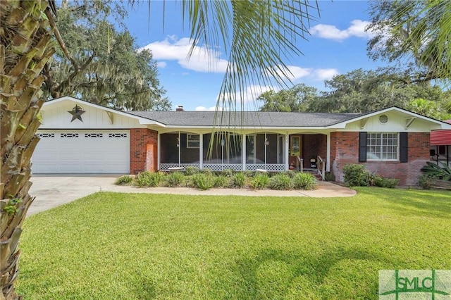 single story home with a front yard, a garage, and a sunroom