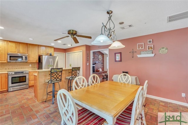 dining space featuring ceiling fan