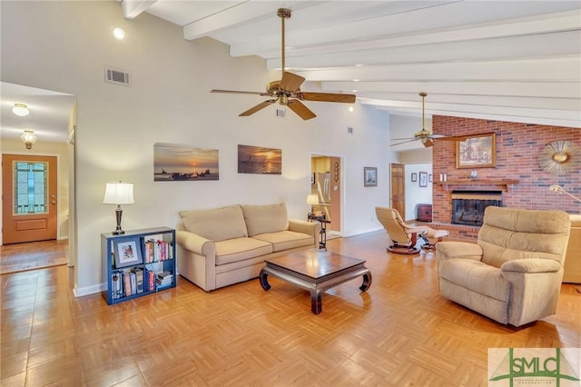 living room featuring a fireplace, lofted ceiling with beams, light parquet floors, and ceiling fan