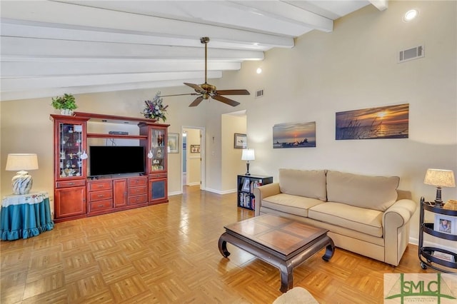 living room with vaulted ceiling with beams, ceiling fan, and light parquet flooring