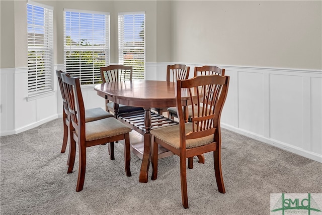 dining room featuring light colored carpet