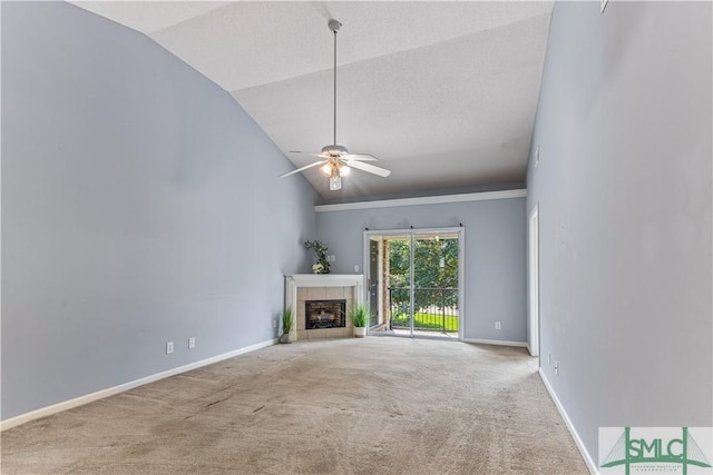 unfurnished living room with baseboards, ceiling fan, vaulted ceiling, carpet floors, and a fireplace