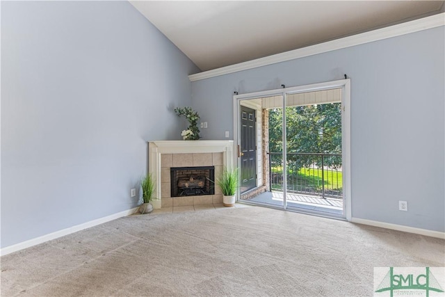 unfurnished living room with lofted ceiling, carpet flooring, and baseboards