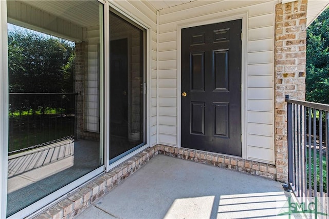 doorway to property featuring a balcony