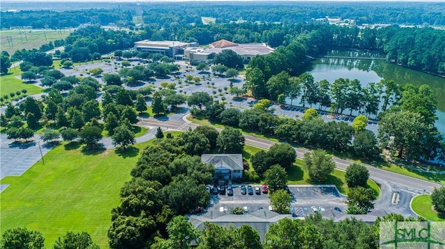 birds eye view of property with a water view and a residential view