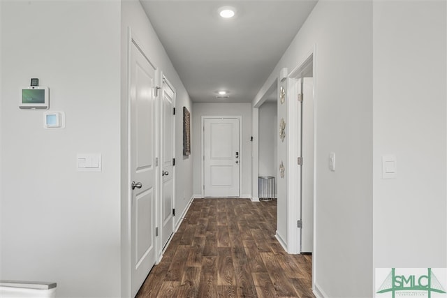 corridor featuring dark wood-type flooring