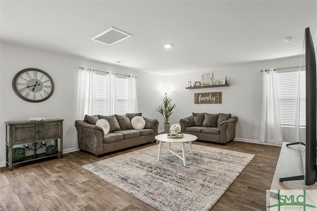 living area with dark wood-style floors and baseboards