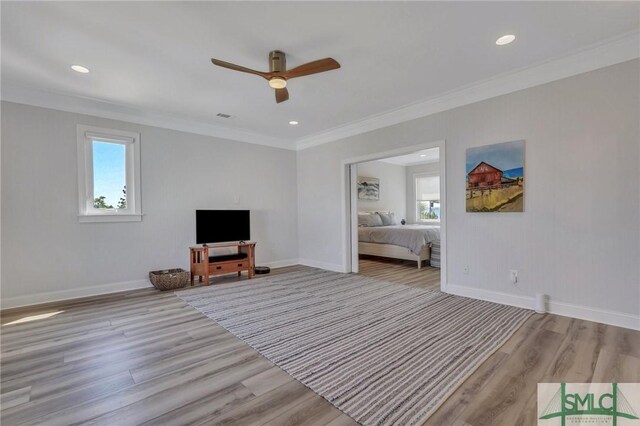 unfurnished living room featuring light wood-type flooring, ceiling fan, and a wealth of natural light