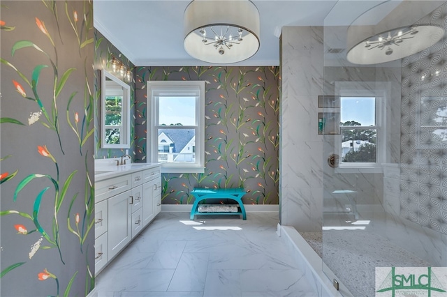 bathroom featuring tile patterned flooring, vanity, and crown molding