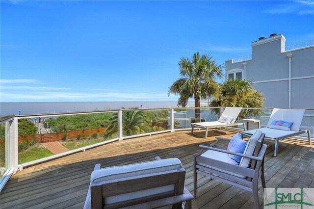 deck featuring an outdoor hangout area and a water view