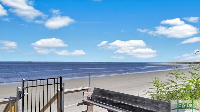 view of community with a view of the beach and a water view