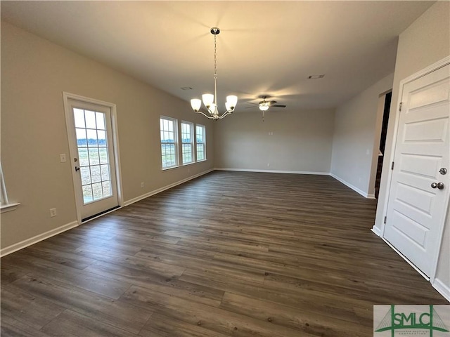 unfurnished dining area featuring ceiling fan with notable chandelier and dark hardwood / wood-style floors