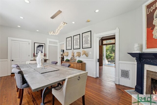 dining area featuring dark wood-type flooring