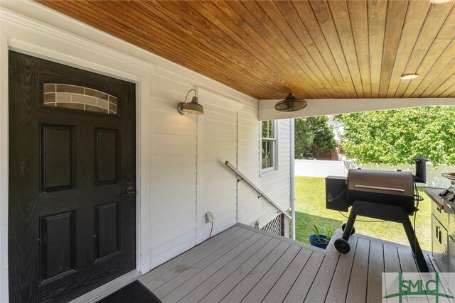 wooden deck with ceiling fan