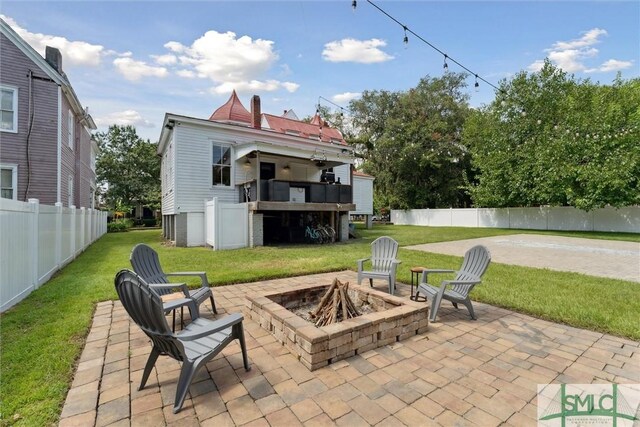 view of patio / terrace featuring an outdoor fire pit