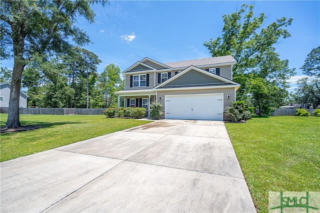 view of front of property with a garage and a front yard