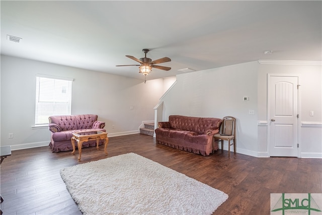 living room with ceiling fan and dark hardwood / wood-style flooring