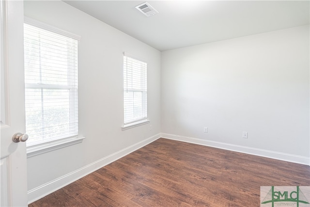 unfurnished room featuring wood-type flooring