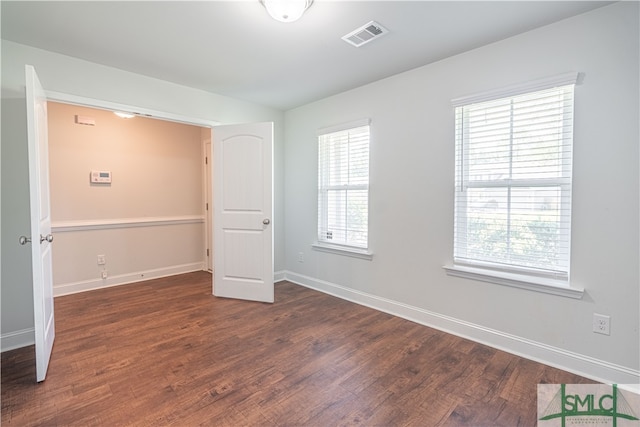 unfurnished bedroom featuring hardwood / wood-style flooring