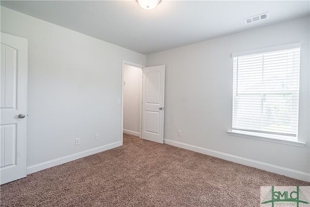 view of carpeted spare room